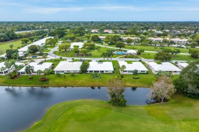 Shimmering lake and golf course views from this luxurious 3 on Quail Ridge Golf Course and Country Club in Florida - for sale on GolfHomes.com, golf home, golf lot