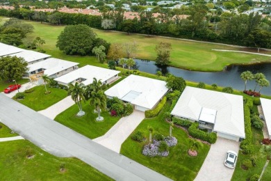 Shimmering lake and golf course views from this luxurious 3 on Quail Ridge Golf Course and Country Club in Florida - for sale on GolfHomes.com, golf home, golf lot