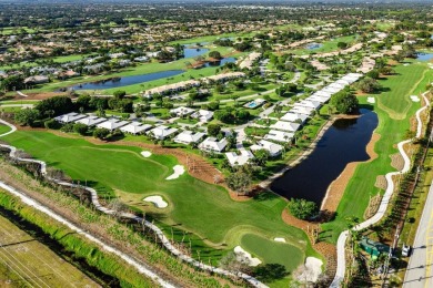 Shimmering lake and golf course views from this luxurious 3 on Quail Ridge Golf Course and Country Club in Florida - for sale on GolfHomes.com, golf home, golf lot