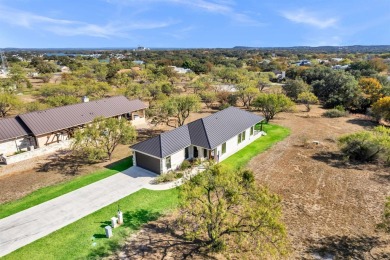 Discover the perfect blend of modern comfort and resort-style on Apple Rock Golf Course - Horseshoe Bay in Texas - for sale on GolfHomes.com, golf home, golf lot