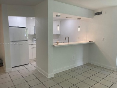 Beautifully updated apartment offering true peace of mind and on Country Club of Miami in Florida - for sale on GolfHomes.com, golf home, golf lot