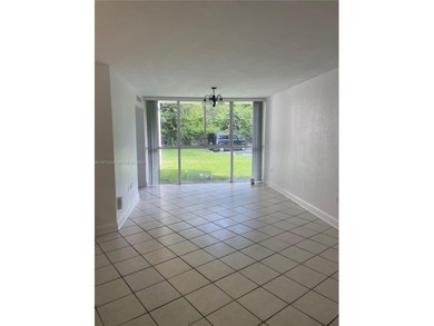Beautifully updated apartment offering true peace of mind and on Country Club of Miami in Florida - for sale on GolfHomes.com, golf home, golf lot
