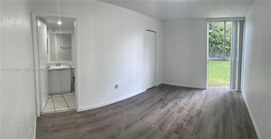 Beautifully updated apartment offering true peace of mind and on Country Club of Miami in Florida - for sale on GolfHomes.com, golf home, golf lot