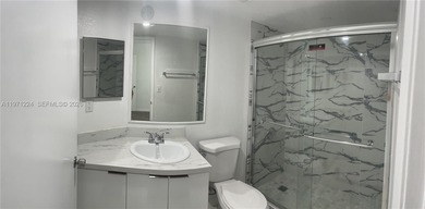 Beautifully updated apartment offering true peace of mind and on Country Club of Miami in Florida - for sale on GolfHomes.com, golf home, golf lot