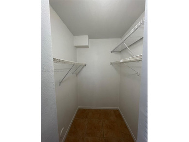Beautifully updated apartment offering true peace of mind and on Country Club of Miami in Florida - for sale on GolfHomes.com, golf home, golf lot