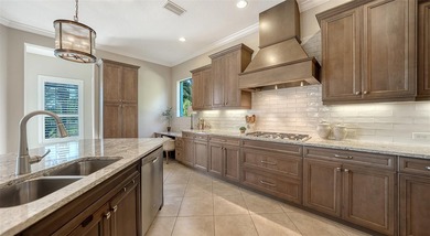 Privately positioned on an oversized homesite within the gated on Ritz-Carlton Members Golf Club in Florida - for sale on GolfHomes.com, golf home, golf lot