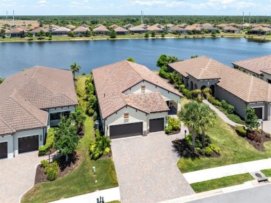 Experience casual lakefront luxury in this stunning residence on Boca Royale Golf and Country Club in Florida - for sale on GolfHomes.com, golf home, golf lot