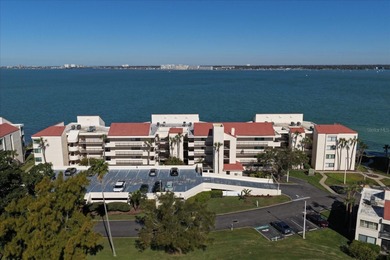 Welcome to La Puerta Del Sol, a serene waterfront retreat on Isla Del Sol Yacht and Country Club in Florida - for sale on GolfHomes.com, golf home, golf lot