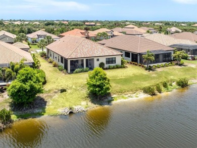 Experience casual lakefront luxury in this stunning residence on Boca Royale Golf and Country Club in Florida - for sale on GolfHomes.com, golf home, golf lot