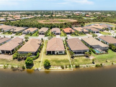 Experience casual lakefront luxury in this stunning residence on Boca Royale Golf and Country Club in Florida - for sale on GolfHomes.com, golf home, golf lot