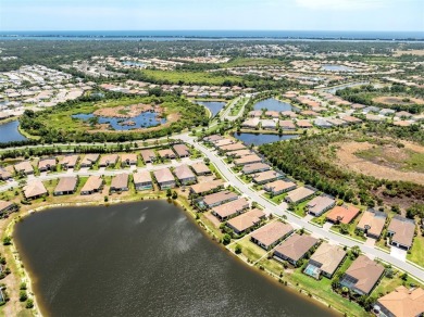 Experience casual lakefront luxury in this stunning residence on Boca Royale Golf and Country Club in Florida - for sale on GolfHomes.com, golf home, golf lot