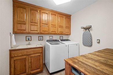 Discover the perfect mix of comfort, space, and country charm in on Fayetteville Country Club in Arkansas - for sale on GolfHomes.com, golf home, golf lot