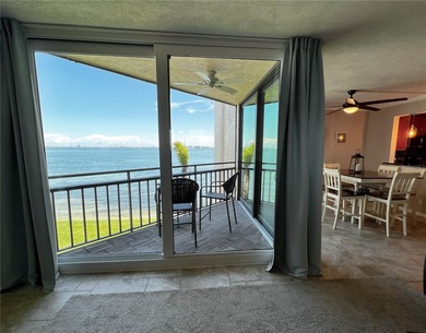 Welcome to La Puerta Del Sol, a serene waterfront retreat on Isla Del Sol Yacht and Country Club in Florida - for sale on GolfHomes.com, golf home, golf lot