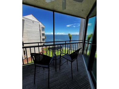 Welcome to La Puerta Del Sol, a serene waterfront retreat on Isla Del Sol Yacht and Country Club in Florida - for sale on GolfHomes.com, golf home, golf lot