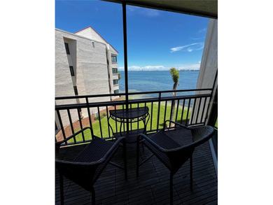 Welcome to La Puerta Del Sol, a serene waterfront retreat on Isla Del Sol Yacht and Country Club in Florida - for sale on GolfHomes.com, golf home, golf lot