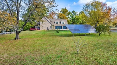 Discover the perfect mix of comfort, space, and country charm in on Fayetteville Country Club in Arkansas - for sale on GolfHomes.com, golf home, golf lot