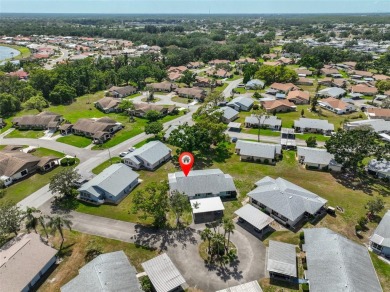 Located on a quiet cul-de-sac and just steps from the covered on Kings Point Executive Golf Course in Florida - for sale on GolfHomes.com, golf home, golf lot