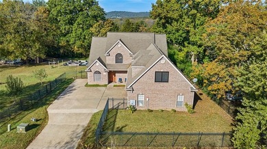 Discover the perfect mix of comfort, space, and country charm in on Fayetteville Country Club in Arkansas - for sale on GolfHomes.com, golf home, golf lot