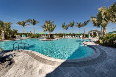 Experience casual lakefront luxury in this stunning residence on Boca Royale Golf and Country Club in Florida - for sale on GolfHomes.com, golf home, golf lot