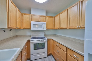 Located on a quiet cul-de-sac and just steps from the covered on Kings Point Executive Golf Course in Florida - for sale on GolfHomes.com, golf home, golf lot