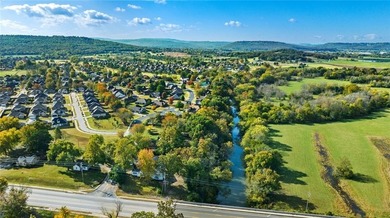 Discover the perfect mix of comfort, space, and country charm in on Fayetteville Country Club in Arkansas - for sale on GolfHomes.com, golf home, golf lot