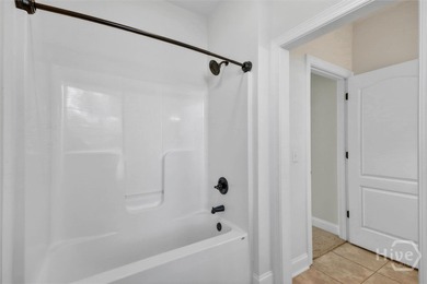 Located in the desirable Claybourn neighborhood, this 5 bedroom on Sterling Links Golf Club in Georgia - for sale on GolfHomes.com, golf home, golf lot