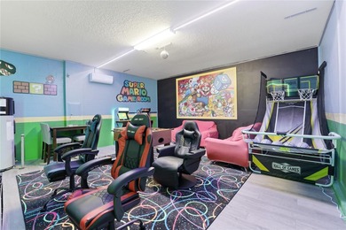 Overhauled by  Superhosts and designed for five-star stays -- on The Oasis Club at Champions Gate in Florida - for sale on GolfHomes.com, golf home, golf lot