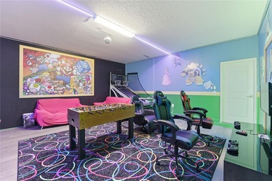 Overhauled by  Superhosts and designed for five-star stays -- on The Oasis Club at Champions Gate in Florida - for sale on GolfHomes.com, golf home, golf lot