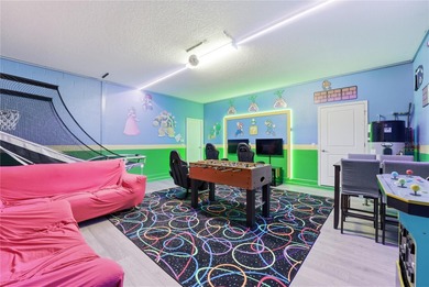 Overhauled by  Superhosts and designed for five-star stays -- on The Oasis Club at Champions Gate in Florida - for sale on GolfHomes.com, golf home, golf lot