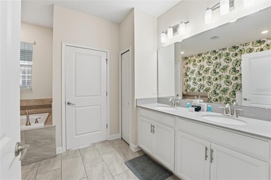 Overhauled by  Superhosts and designed for five-star stays -- on The Oasis Club at Champions Gate in Florida - for sale on GolfHomes.com, golf home, golf lot