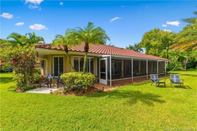 Welcome to this beautifully landscaped 4 bedroom, 2 bath home on St. Lucie Trail Golf Club in Florida - for sale on GolfHomes.com, golf home, golf lot