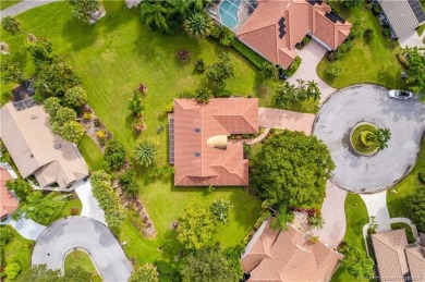 Welcome to this beautifully landscaped 4 bedroom, 2 bath home on St. Lucie Trail Golf Club in Florida - for sale on GolfHomes.com, golf home, golf lot