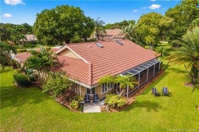 Welcome to this beautifully landscaped 4 bedroom, 2 bath home on St. Lucie Trail Golf Club in Florida - for sale on GolfHomes.com, golf home, golf lot