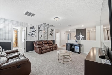 Overhauled by  Superhosts and designed for five-star stays -- on The Oasis Club at Champions Gate in Florida - for sale on GolfHomes.com, golf home, golf lot