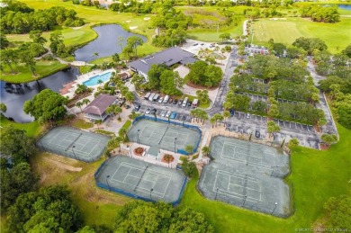 Welcome to this beautifully landscaped 4 bedroom, 2 bath home on St. Lucie Trail Golf Club in Florida - for sale on GolfHomes.com, golf home, golf lot