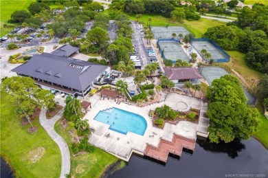 Welcome to this beautifully landscaped 4 bedroom, 2 bath home on St. Lucie Trail Golf Club in Florida - for sale on GolfHomes.com, golf home, golf lot