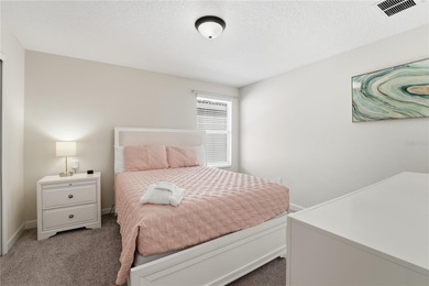 Overhauled by  Superhosts and designed for five-star stays -- on The Oasis Club at Champions Gate in Florida - for sale on GolfHomes.com, golf home, golf lot