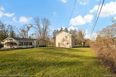 Welcome to your dream home! This stunningly updated home offers on Rush Lake Hills Golf Club in Michigan - for sale on GolfHomes.com, golf home, golf lot