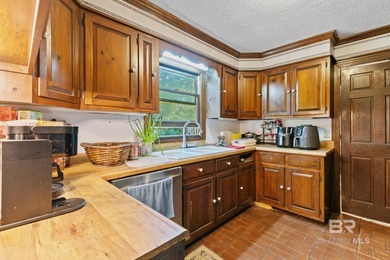 Bring your vision and unlock the potential of this spacious on Holly Hills Country Club in Alabama - for sale on GolfHomes.com, golf home, golf lot