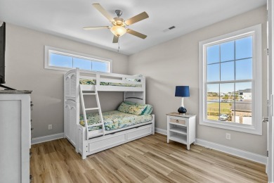This custom-built raised beach home in the gated community of on Arrowhead Country Club in South Carolina - for sale on GolfHomes.com, golf home, golf lot