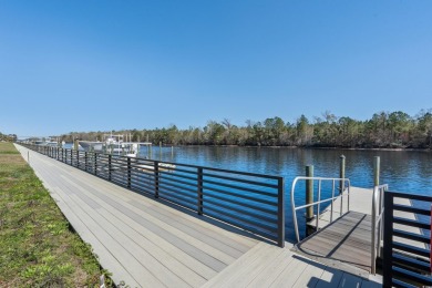 This custom-built raised beach home in the gated community of on Arrowhead Country Club in South Carolina - for sale on GolfHomes.com, golf home, golf lot