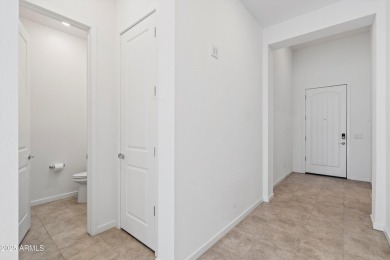 This stunning 3-bedroom, 2.5-bathroom home is nestled within a on Palm Valley Golf Club  in Arizona - for sale on GolfHomes.com, golf home, golf lot