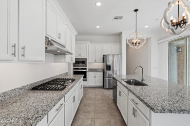 This stunning 3-bedroom, 2.5-bathroom home is nestled within a on Palm Valley Golf Club  in Arizona - for sale on GolfHomes.com, golf home, golf lot