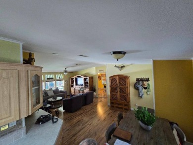 THIS PALM HARBOR 3/2 SPLIT PLAN FEATURES OVER 1300 SQ FT AND HAS on Southport Springs Golf Club in Florida - for sale on GolfHomes.com, golf home, golf lot