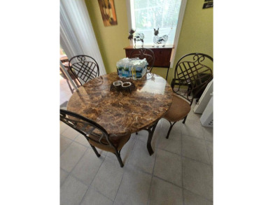 THIS PALM HARBOR 3/2 SPLIT PLAN FEATURES OVER 1300 SQ FT AND HAS on Southport Springs Golf Club in Florida - for sale on GolfHomes.com, golf home, golf lot