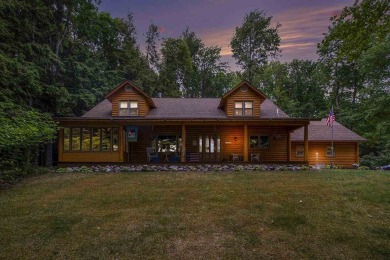 Welcome to 4708 Lake Road, a stunning custom built log home on Harbor Point Golf Club in Michigan - for sale on GolfHomes.com, golf home, golf lot