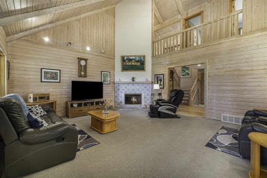 Welcome to 4708 Lake Road, a stunning custom built log home on Harbor Point Golf Club in Michigan - for sale on GolfHomes.com, golf home, golf lot