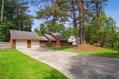 This charming Mid-Century home in Lithonia's Saddlewood on Mystery Valley Golf Course in Georgia - for sale on GolfHomes.com, golf home, golf lot