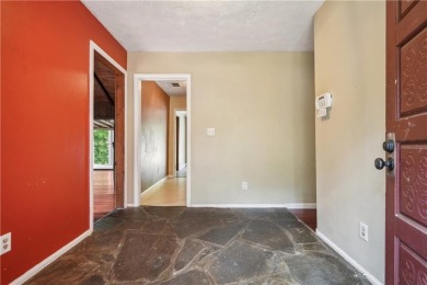 This charming Mid-Century home in Lithonia's Saddlewood on Mystery Valley Golf Course in Georgia - for sale on GolfHomes.com, golf home, golf lot