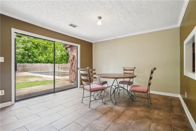 This charming Mid-Century home in Lithonia's Saddlewood on Mystery Valley Golf Course in Georgia - for sale on GolfHomes.com, golf home, golf lot